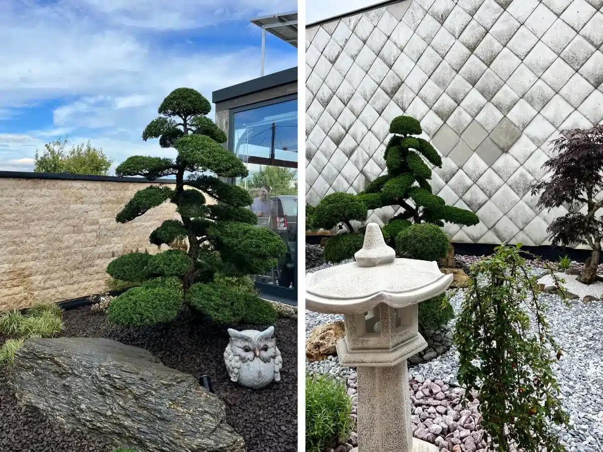 Soška sovy a kameninová lampa v japonské zahradě.